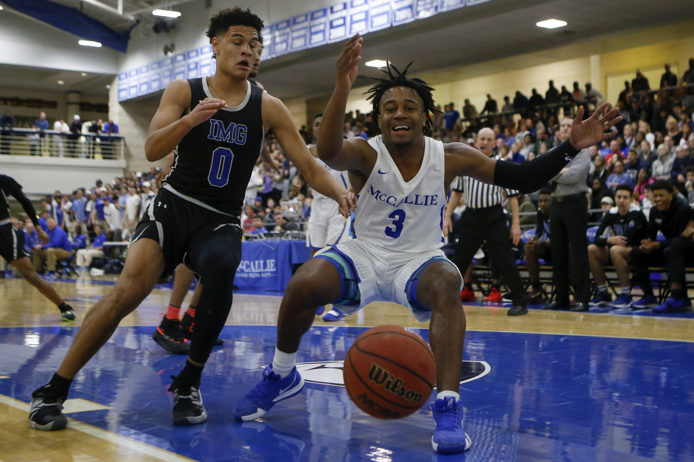 McCallie's Shannon Walker (3) reacts after he loses the ball while being defended by IMG Academy's Josh Green (0) during The McCallie Dr Pepper TEN Classic at the Walker Forum on the campus of the McCallie School on Friday, Feb. 1, 2019 in Chattanooga, Tenn.
