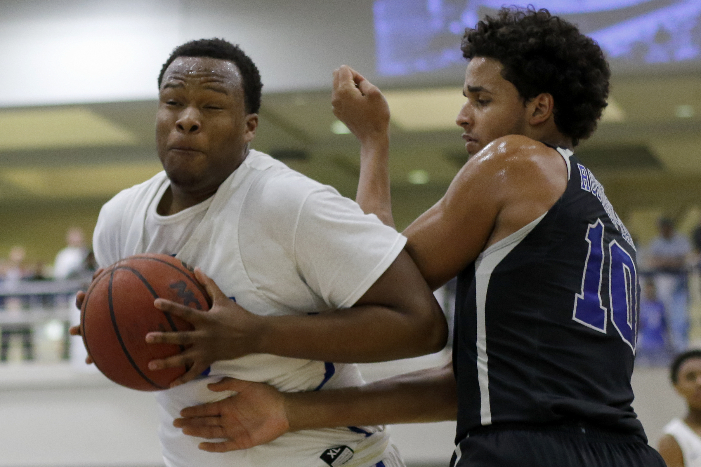 McCallie's John Hardy (23) works against IMG Academy's Jeremiah Robinson-Earl (10) during The McCallie Dr Pepper TEN Classic at the Walker Forum on the campus of the McCallie School on Friday, Feb. 1, 2019 in Chattanooga, Tenn.