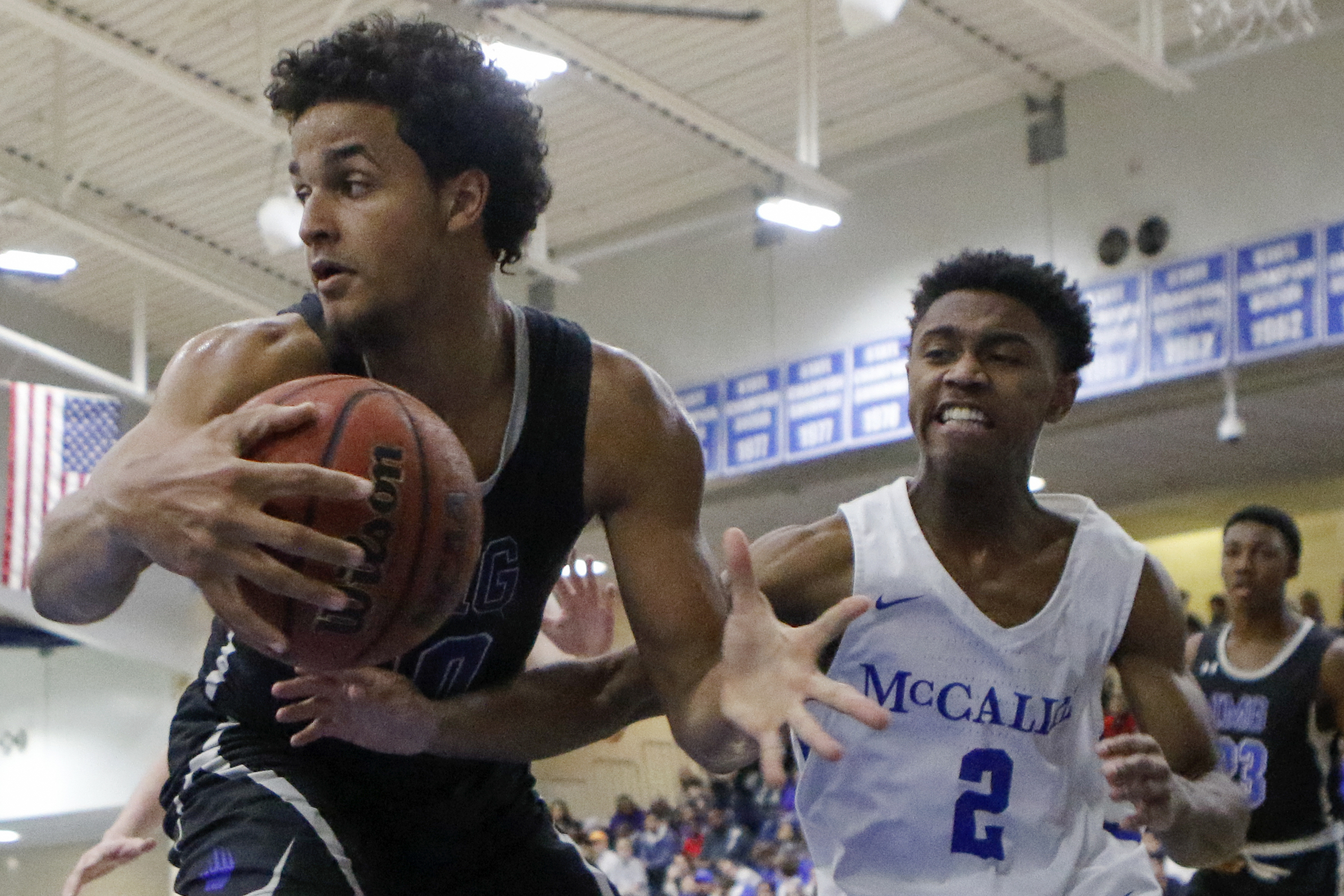 McCallie's Kameron Watson (2) tries to steal the ball from IMG Academy's Jeremiah Robinson-Earl during their teams' game Friday night in the Dr Pepper TEN Classic at McCallie. IMG won 66-49.