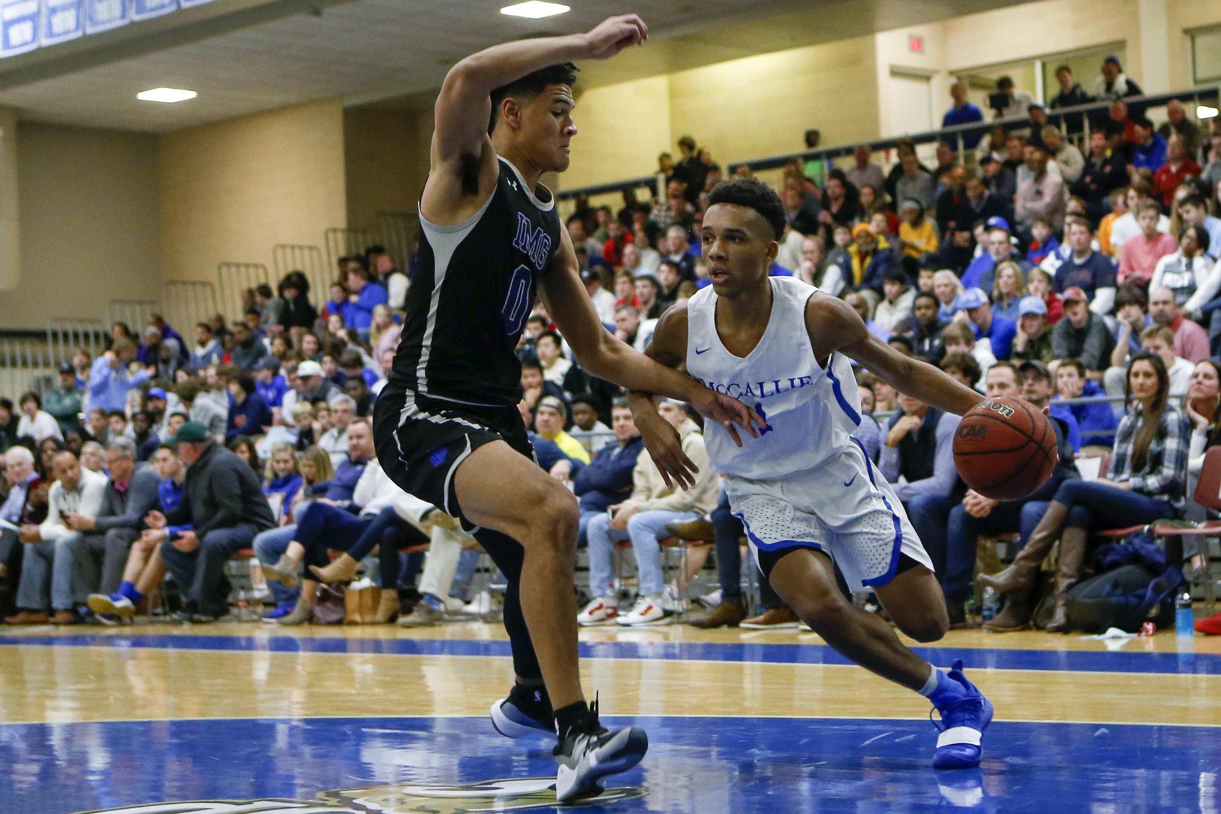 McCallie's Eric Rivers (1) drives against IMG Academy's Josh Green (0) during The McCallie Dr Pepper TEN Classic at the Walker Forum on the campus of the McCallie School on Friday, Feb. 1, 2019 in Chattanooga, Tenn.