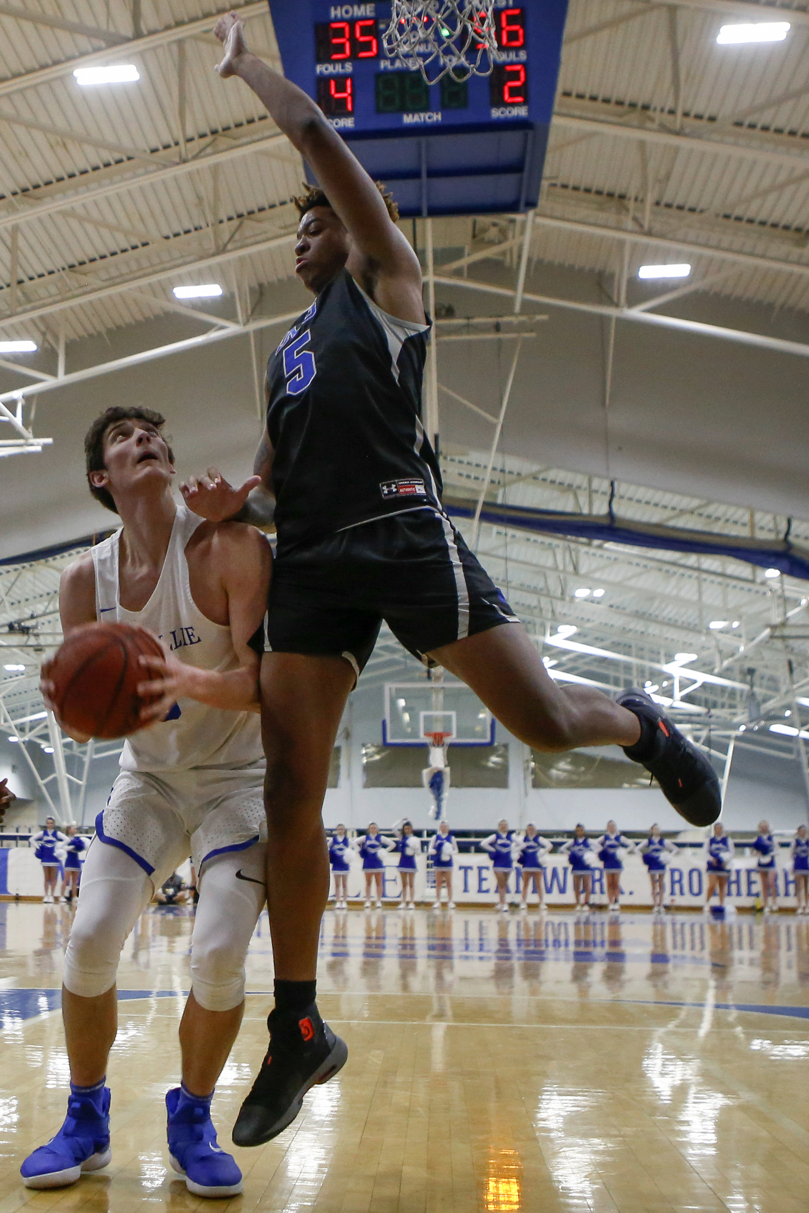 McCallie's Neill Dickey (0) is fouled by IMG Academy's Armando Bacot (5) during The McCallie Dr Pepper TEN Classic at the Walker Forum on the campus of the McCallie School on Friday, Feb. 1, 2019 in Chattanooga, Tenn.