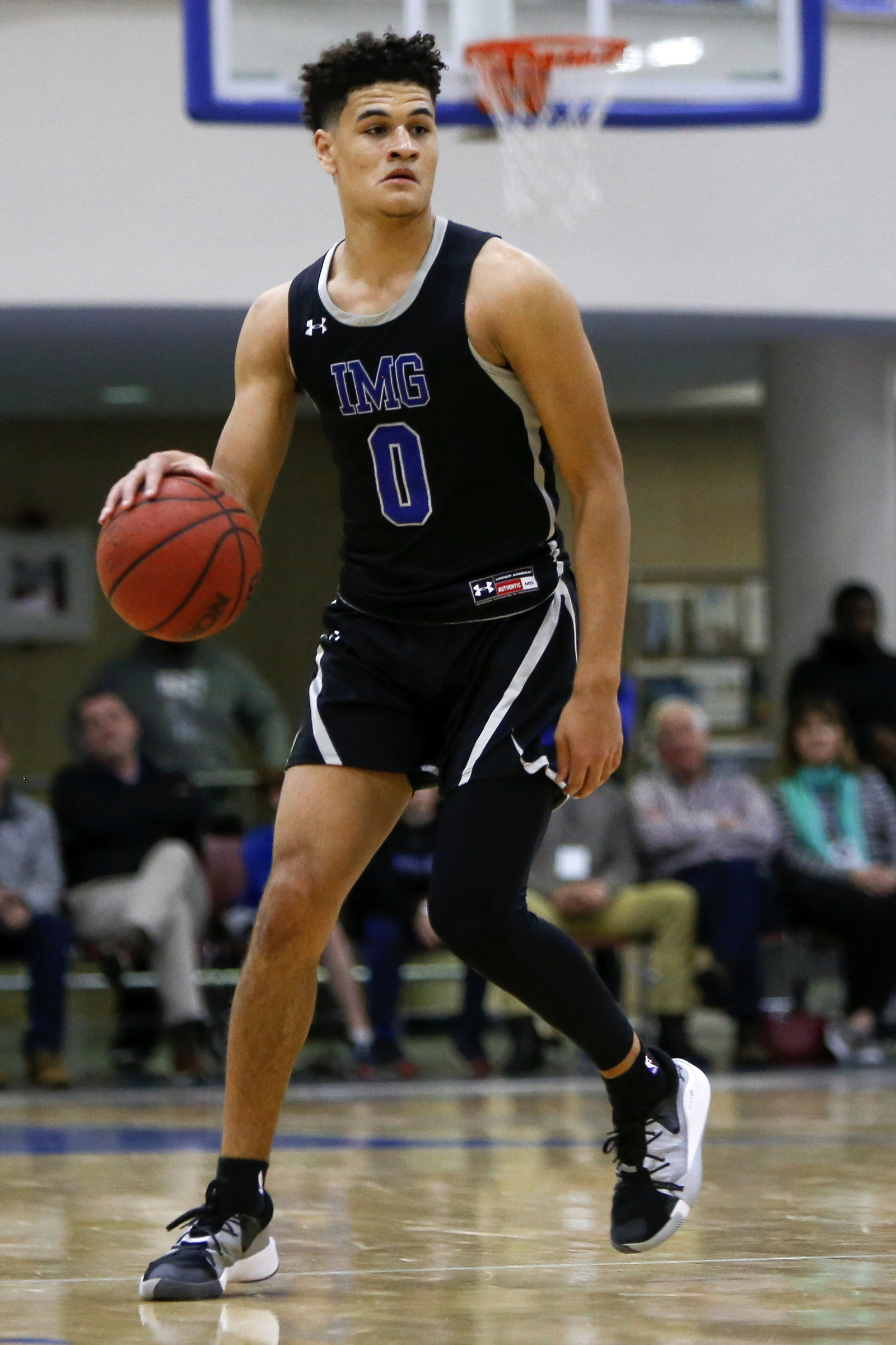 IMG Academy's Josh Green (0) handles the ball against McCallie during The McCallie Dr Pepper TEN Classic at the Walker Forum on the campus of the McCallie School on Friday, Feb. 1, 2019 in Chattanooga, Tenn.