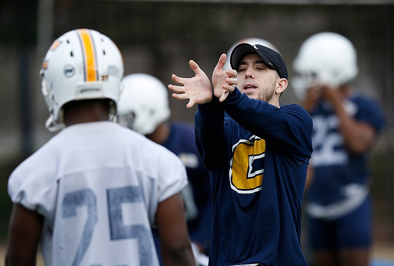 Jeremiah Wilson coaches UTC players during the Mocs' first spring practice of 2018 last February. He is expected to become a defensive quality control assistant at Tennessee.