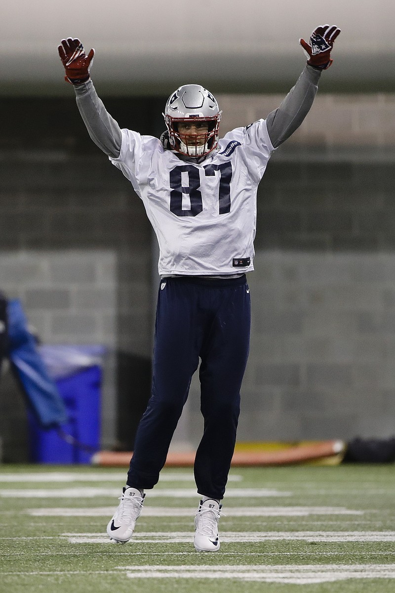 New England Patriots tight end Rob Gronkowski, shown warming up during a team practice last Friday in advance of Super Bowl LIII in Atlanta, said he was hit in the head by a beer can during a parade this week celebrating their victory against the Los Angeles Rams.