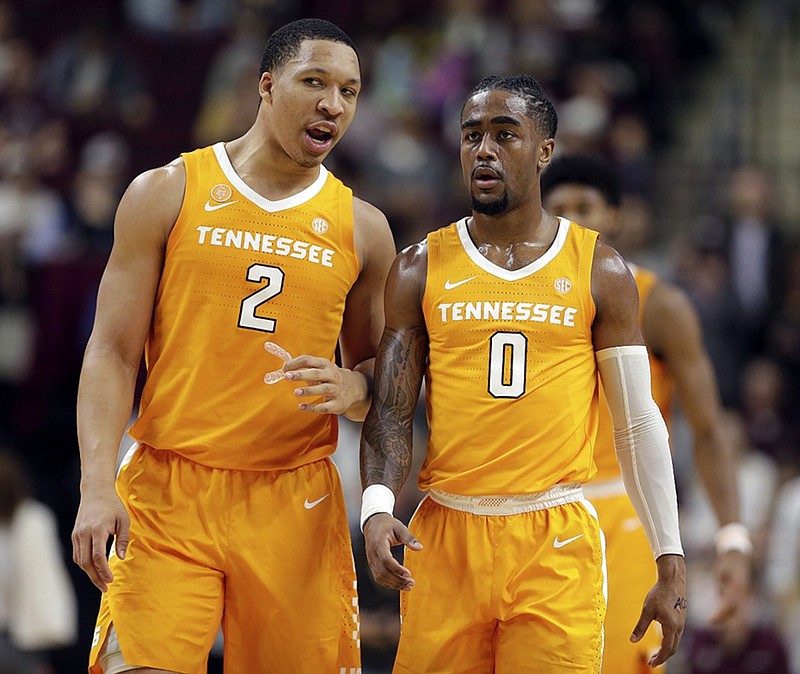 Tennessee forward Grant Williams, left, and point guard Jordan Bone talk during the first half of Saturday night's game against Texas A&M in College Station, Texas. Williams scored 22 points and Bone had 19 points and 10 assists as the top-ranked Vols won 93-76.