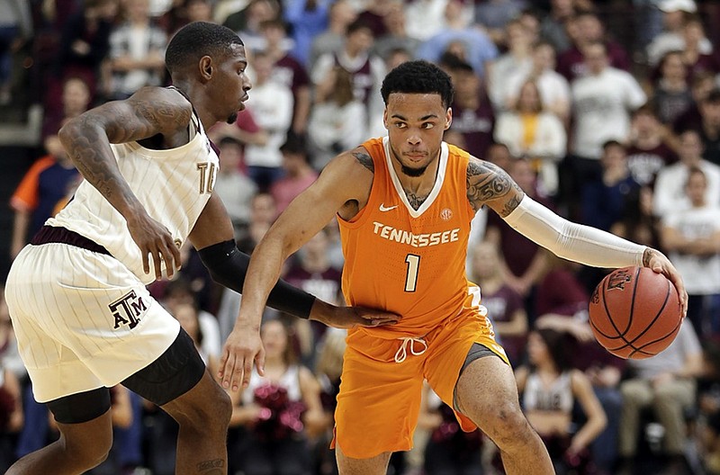 Tennessee's Lamonte Turner dribbles while guarded by Texas A&M's Jay Jay Chandler on Saturday night in College Station, Texas. Turner finished with 19 points and seven assists as the No. 1 Vols won 93-76 to extend their streak of victories to 16 straight games, which broke a program record.