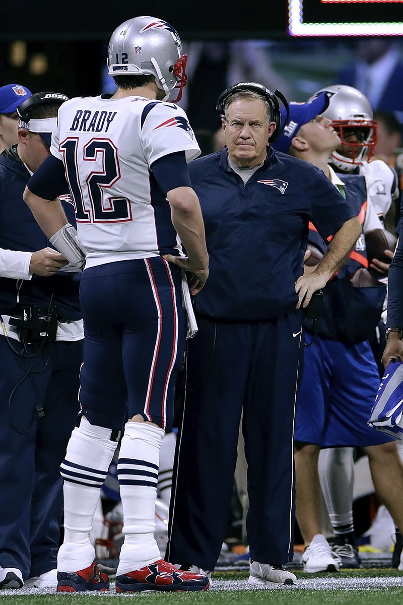 New England Patriots quarterback Tom Brady and coach Bill Belichick talk during the first half of Super Bowl LIII against the Los Angeles Rams on Sunday night at Mercedes-Benz Stadium in Atlanta.