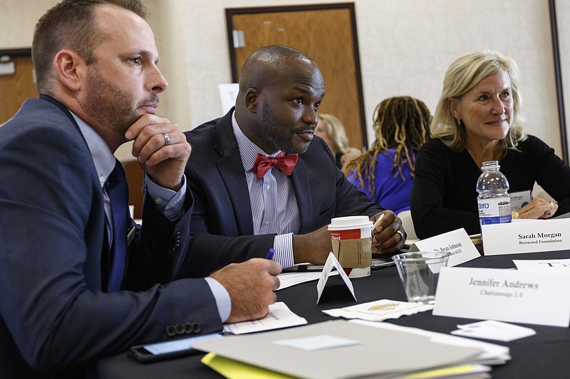 Staff photo by Doug Strickland / Dr. Jared Bigham with Chattanooga 2.0, left, Hamilton County Schools Superintendent Dr. Bryan Johnson, center, and Sarah Morgan with the Benwood foundation talk in a group session about the Chattanooga 2.0 initiative in the summer of 2017.