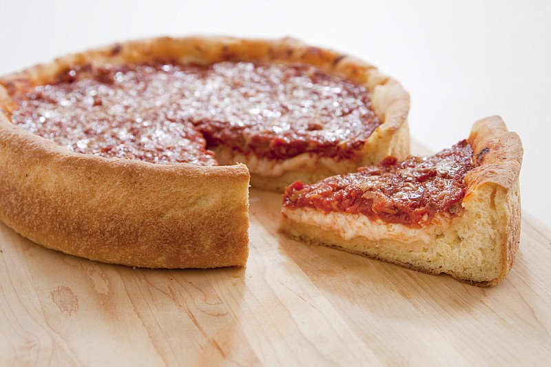 This undated photo provided by America's Test Kitchen in January 2019 shows a Deep-Dish Pizza in Brookline, Mass. This recipe appears in the cookbook "Bread Illustrated." (Carl Tremblay/America's Test Kitchen via AP)