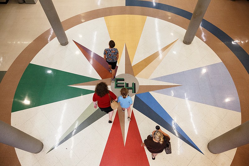 Families arrive at East Hamilton Middle High School for a community meeting unveiling of plans for the new East Hamilton Middle School on Tuesday, July 10, 2018, in Chattanooga, Tenn. The new $36 million middle school will be built near Apison Elementary.