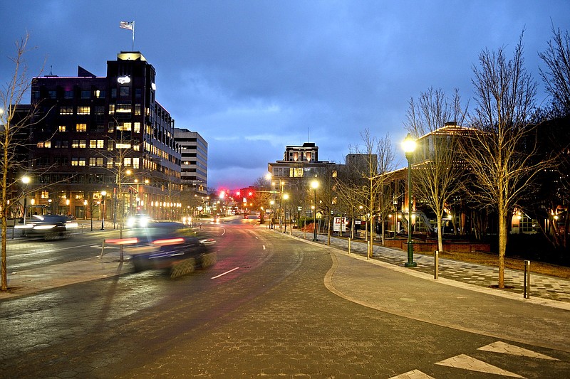 Martin Luther King Jr. Blvd, is seen in the foreground as the Electric Power Board Building, Read House and Waterhouse Pavilion dominate the city skyline.  Rain coats the sidewalks and streets of downtown Chattanooga on January 29, 2018. The tri-state had expected snow, but the few flakes made no impact on travel.