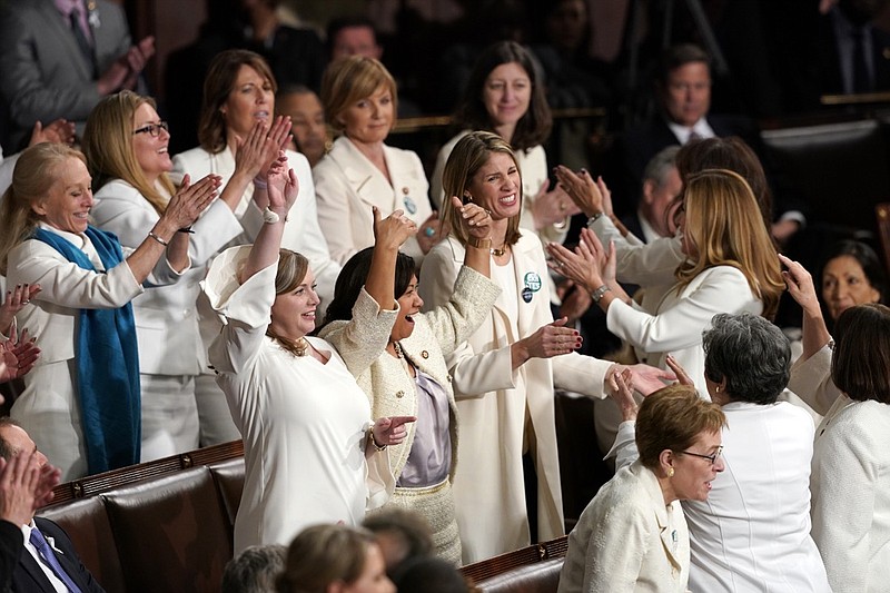 Members of Congress cheer after President Donald Trump acknowledges more women in Congress during his State of the Union address to a joint session of Congress on Capitol Hill in Washington, Tuesday, Feb. 5, 2019. (AP Photo/Carolyn Kaster)
