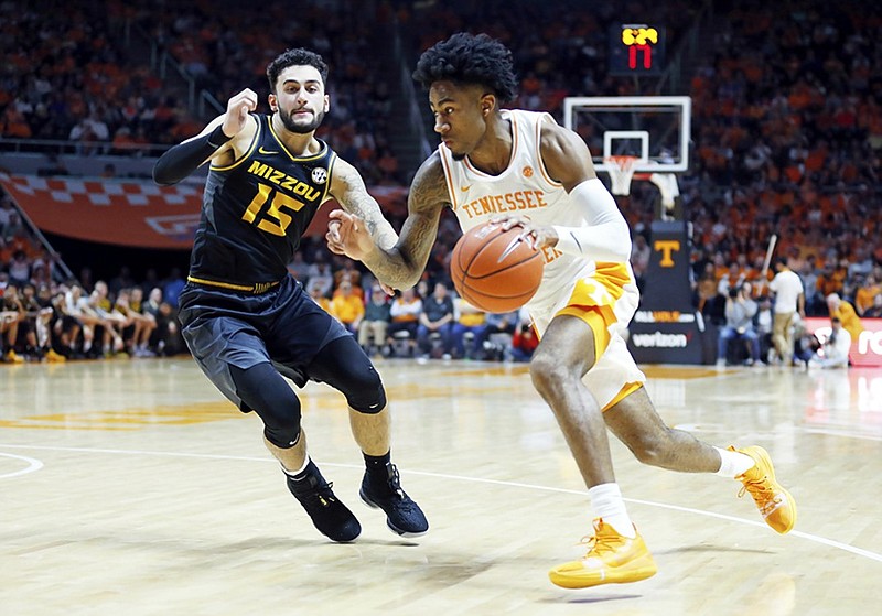 Tennessee guard Jordan Bowden drives past Missouri's Jordan Geist during the second half of Tuesday night's game in Knoxville. The top-ranked Vols won 72-60 to run their winning streak to 17 games.