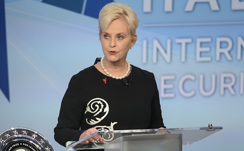 FILE - In this Nov. 17, 2018 file photo, Cindy McCain pauses while presenting the inaugural John McCain Prize for Leadership in Public Service to the People of the island of Lesbos, Greece at the Halifax International Security Forum in Halifax, Canada. McCain is apologizing, Wednesday, Feb. 6, 2019, after claiming that she intervened to stop human trafficking at the Phoenix airport last month. The widow of former U.S. Sen. John McCain told radio hosts at Phoenix station KTAR that she spotted a toddler with a woman of a different ethnicity and "something didn't click." She says she told a police officer, and the woman was waiting for a man who bought the child. (Darren Calabrese /The Canadian Press via AP)

