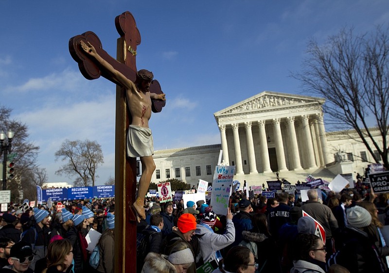 FILE - In this Friday, Jan. 18, 2019 file photo, anti-abortion activists march outside the U.S. Supreme Court building, during the March for Life in Washington. Activists on both sides of the abortion debate react cautiously to a Thursday, Feb. 7, 2019 Supreme Court vote blocking Louisiana from enforcing new abortion regulations, agreeing that the crucial tests of the court's stance are still to come. (AP Photo/Jose Luis Magana)

