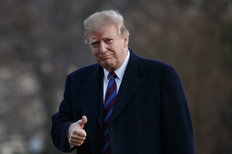 President Donald Trump gives a thumbs-up after arriving on Marine One on the South Lawn of the White House in Washington, Friday, Feb. 8, 2019. The President was returning to the White House after his annual physical exam at Walter Reed National Military Medical Center. (AP Photo/Carolyn Kaster)

