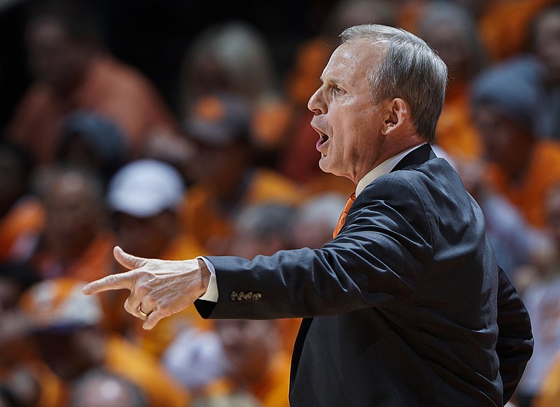 Tennessee men's basketball coach Rick Barnes gives instructions to his players to make adjustments during the top-ranked Vols' win against Florida on Saturday in Knoxville.