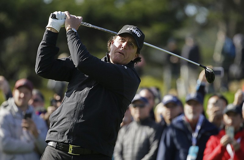 Phil Mickelson follows through and tracks his drive from the fourth tee at Pebble Beach Golf Links during the final round of the AT&T Pebble Beach Pro-Am on Sunday. The round was not completed, but Mickelson was in the lead.