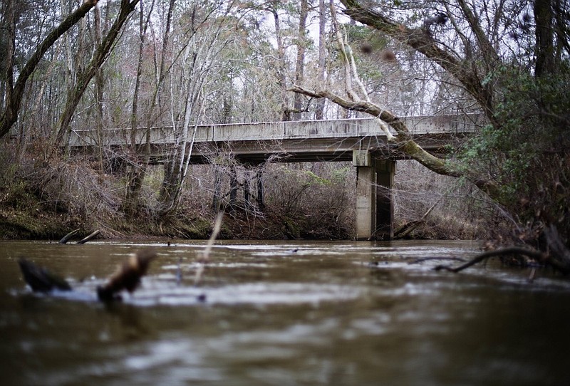 FILE- This Feb. 22, 2018 photo shows a bridge that spans the Apalachee River at Moore's Ford Road where in 1946 two young black couples were stopped by a white mob who dragged them to the riverbank and shot them multiple times in Monroe, Ga. (AP Photo/David Goldman, File)

