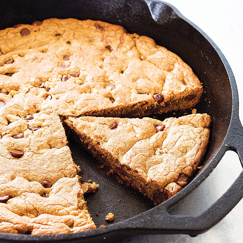This undated photo provided by America's Test Kitchen in January 2019 shows a Chocolate Chip Skillet Cookie in Brookline, Mass. This recipe appears in the cookbook “The Perfect Cookie.” (Daniel J. van Ackere/America's Test Kitchen via AP)