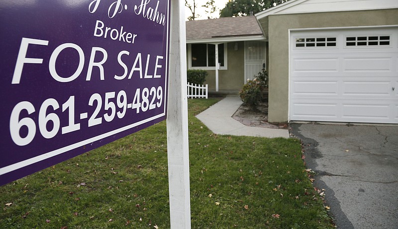 FILE- This Monday, Nov. 3, 2014 file photo shows a house for sale in Los Angeles. The National Association of Realtors reports on sales of existing homes in November on Monday, Dec. 22, 2014. (AP Photo/Richard Vogel, File)