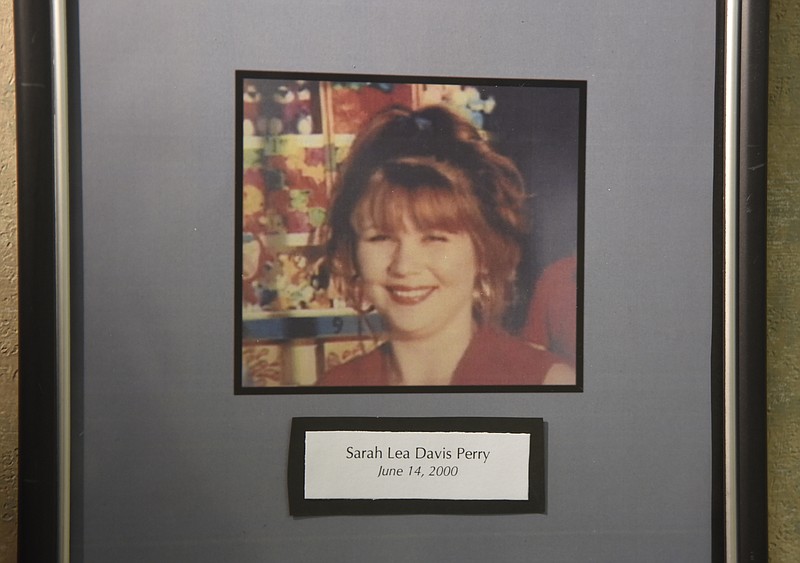 Staff photo by Angela Lewis Foster A photo of Sarah Lea (Davis) Perry hangs on the wall Wednesday, August 17, 2016 in the Cold Case Unit. Tuesday afternoon the Hamilton County Grand Jury indicted 43-year old Jason Kirk Sanford of Westland, Michigan, for First Degree Murder in the June 2000 death of Sarah Lea (Davis) Perry.