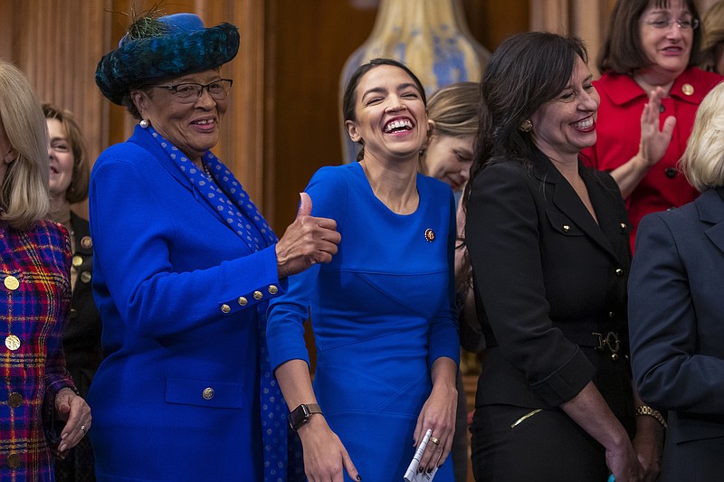 Rep. Alma Adams D-North Carolina, left, with Rep. Alexandria Ocasio-Cortez, D-New York, smiles during a Washington event to advocate for the Paycheck Fairness Act on last month's 10th anniversary of President Barack Obama signing the Lilly Ledbetter Fair Pay Act. (AP Photo/J. Scott Applewhite)