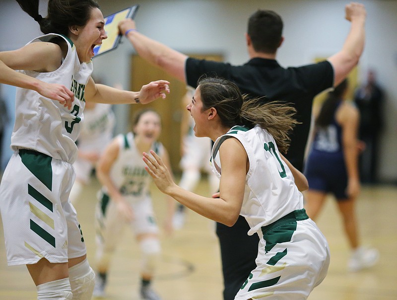 Silverdale's Audrey Canter (3) and Bentlee Stiner (10) celebrate their win over Grace Christian Academy Tuesday, February 12, 2019 at Silverdale Baptist Academy in Chattanooga, Tennessee. 