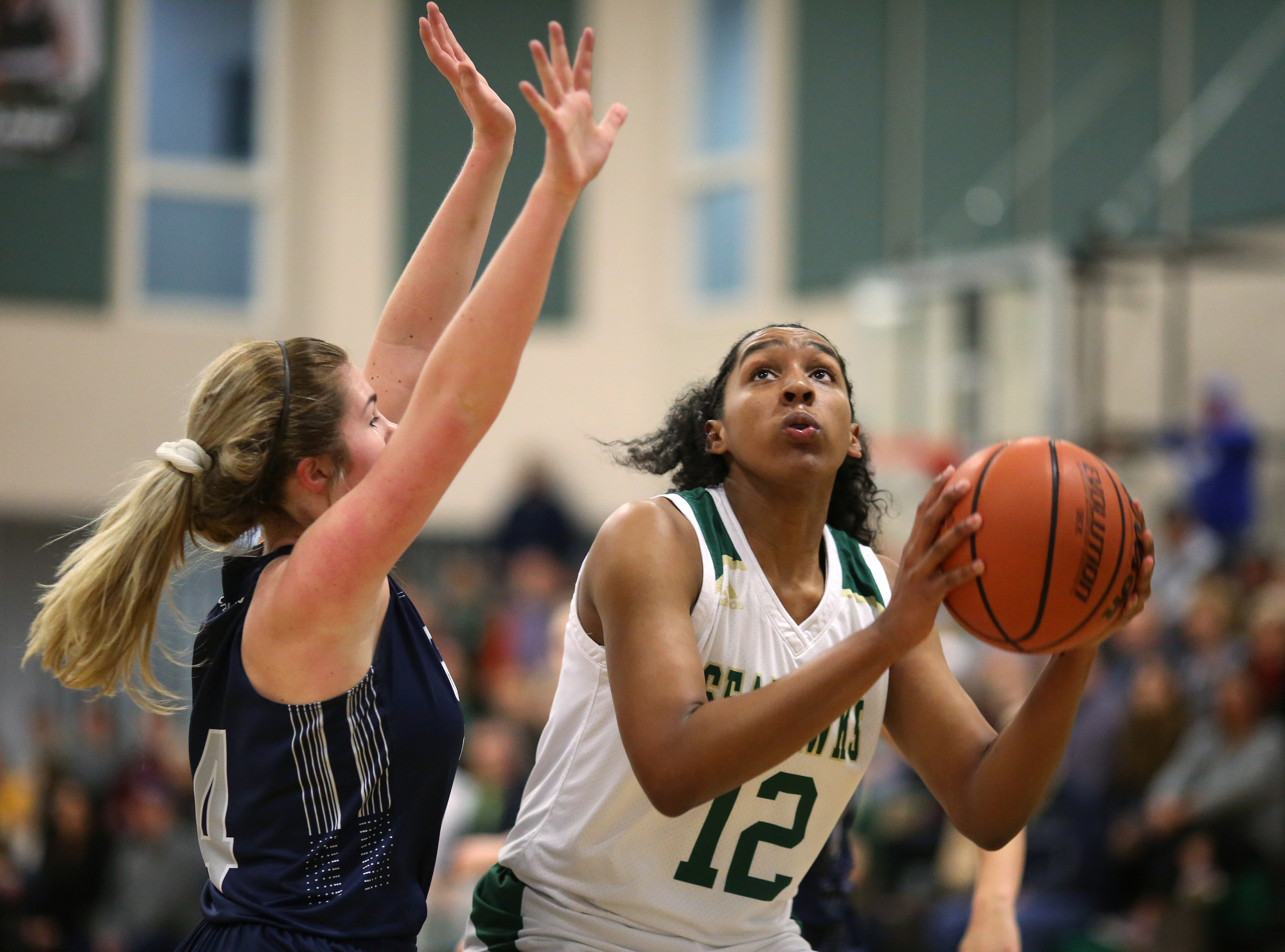 Grace Christian Academy's Faith Hammond (14) puts pressure on Silverdale's Laney Bone (12) as she goes up for a shot during the Silverdale vs. Grace Christian Academy region tournament game Tuesday, February 12, 2019 at Silverdale Baptist Academy in Chattanooga, Tennessee.
