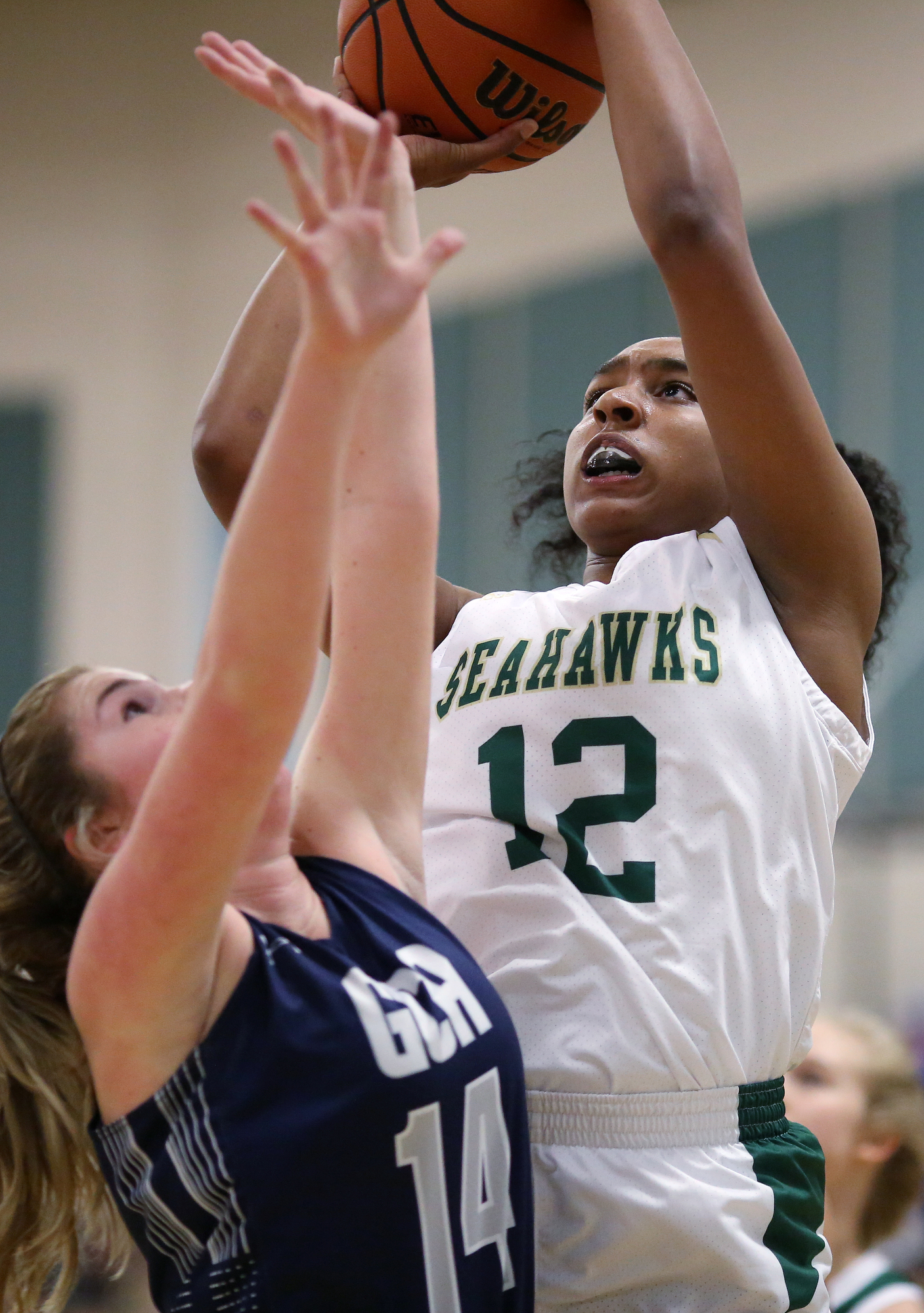 Grace Christian Academy's Faith Hammond (14) puts pressure on Silverdale's Laney Bone (12) as she goes up for a shot during the Silverdale vs. Grace Christian Academy region tournament game Tuesday, February 12, 2019 at Silverdale Baptist Academy in Chattanooga, Tennessee.