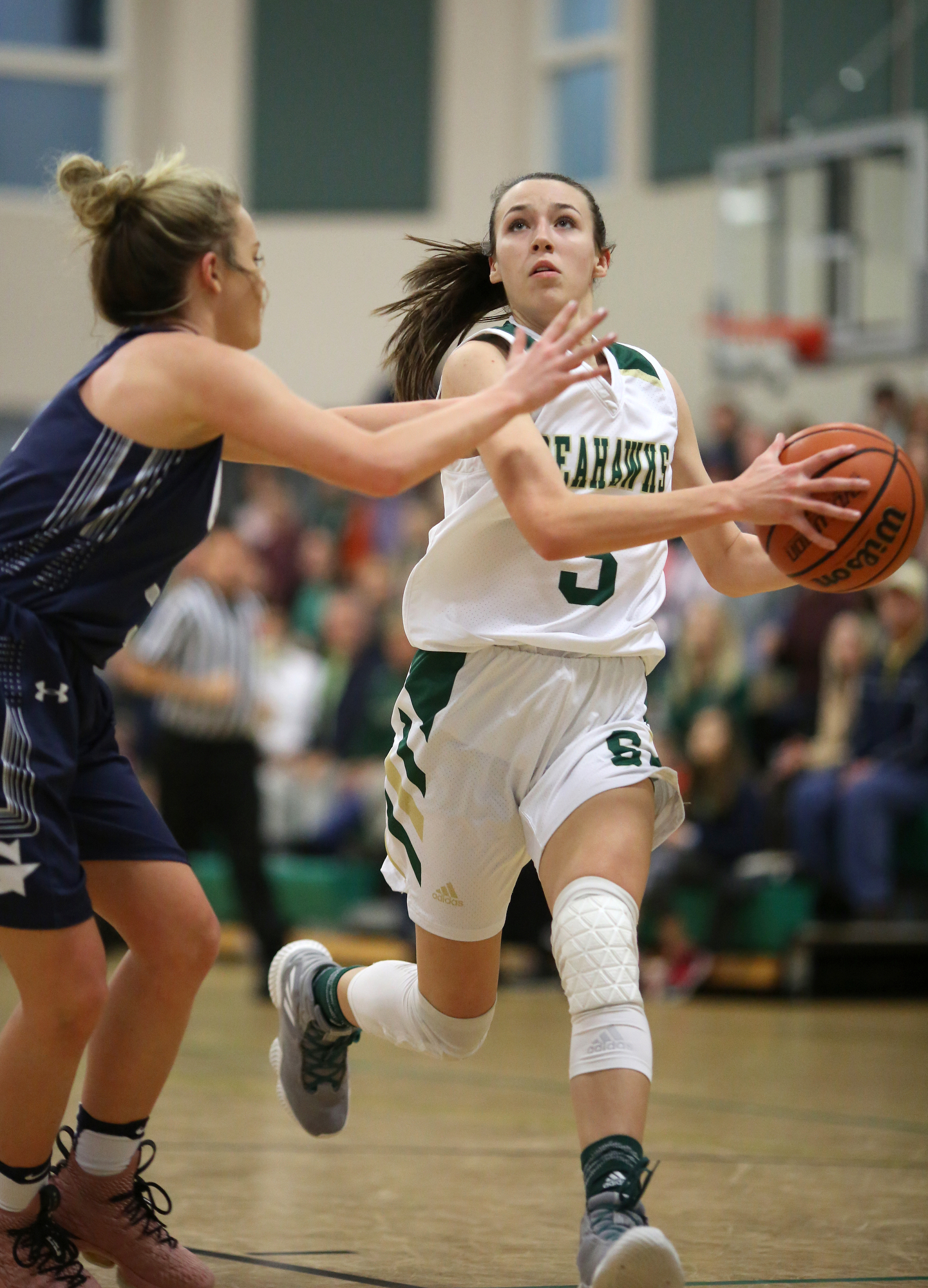 Grace Christian Academy's Cassie Peters (5) puts pressure on Silverdale's Audrey Canter (3) as she looks to put up a shot during the Silverdale vs. Grace Christian Academy region tournament game Tuesday, February 12, 2019 at Silverdale Baptist Academy in Chattanooga, Tennessee.