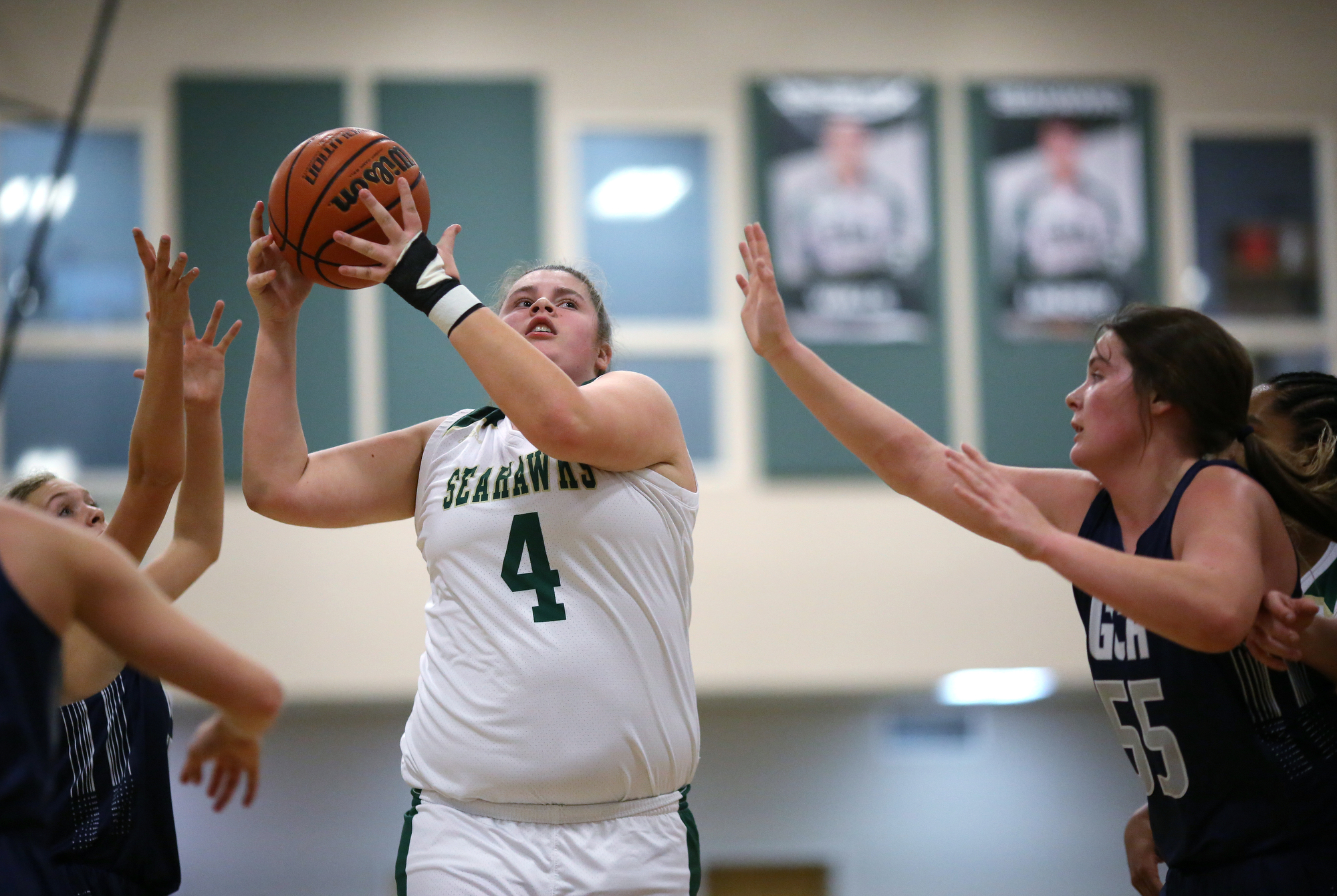 Silverdale's Becca Lamb (4) goes up for a shot while being guarded by Grace Christian Academy's Whitney Campbell (55) during the Silverdale vs. Grace Christian Academy region tournament game Tuesday, February 12, 2019 at Silverdale Baptist Academy in Chattanooga, Tennessee.