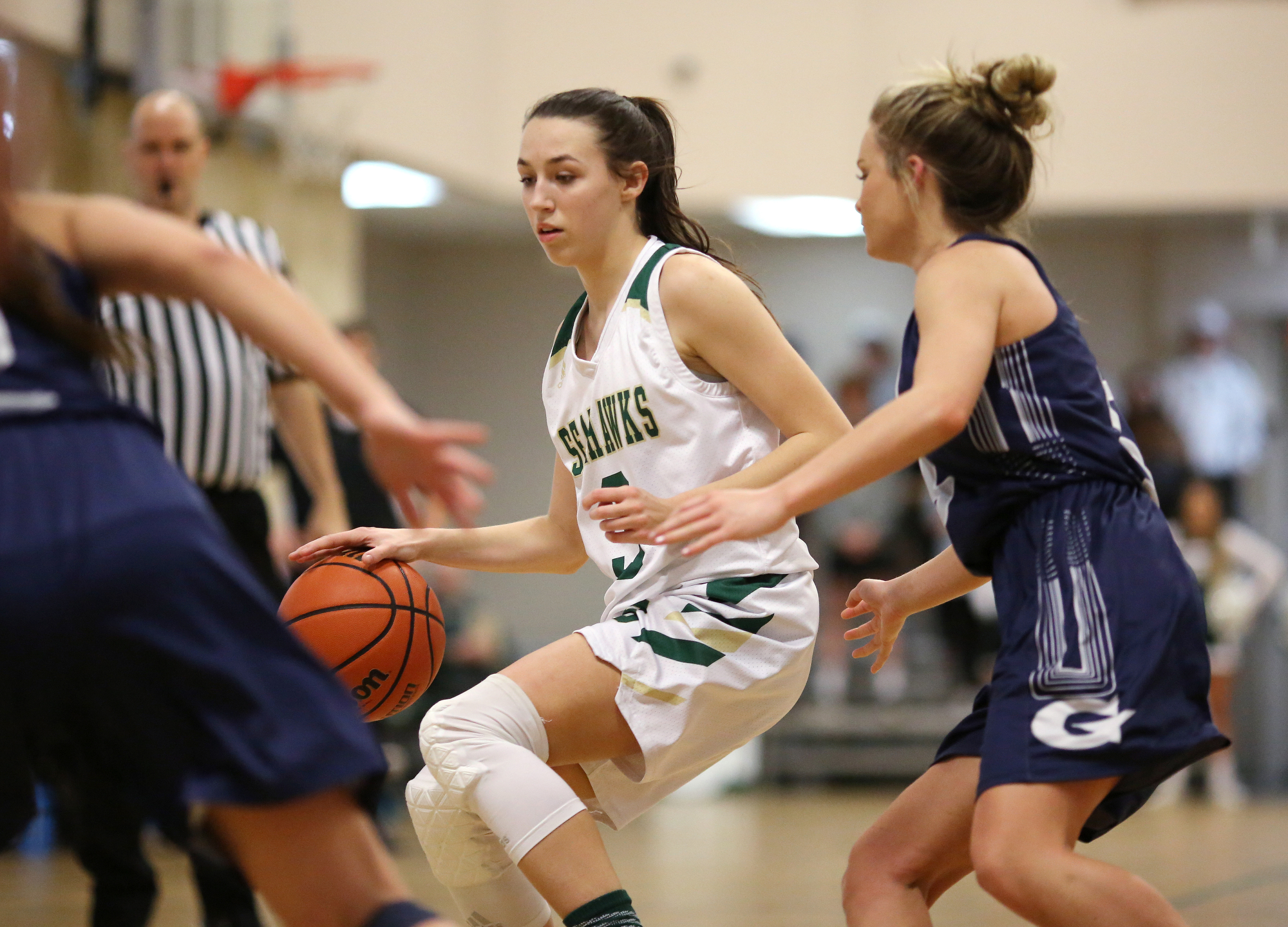 Silverdale's Audrey Canter (3) dribbles the ball while being guarded by Grace Christian Academy's Cassie Peters (5) during the Silverdale vs. Grace Christian Academy region tournament game Tuesday, February 12, 2019 at Silverdale Baptist Academy in Chattanooga, Tennessee.