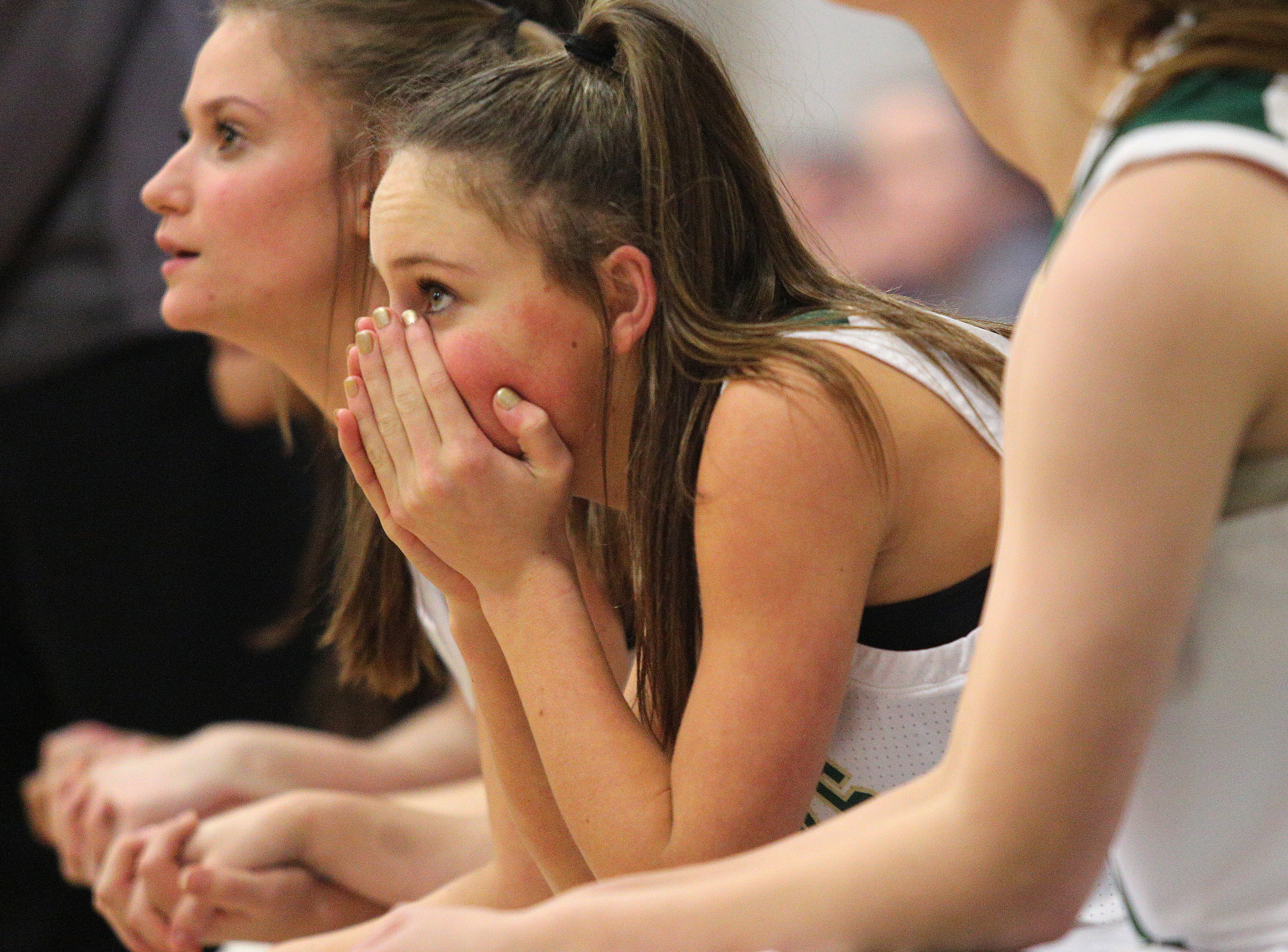Silverdale's Christian Echols (14) covers her face with her hands as she watches from the bench as time ticks down for Silverdale to catch up to Grace Christian during the Silverdale vs. Grace Christian Academy region tournament game Tuesday, February 12, 2019 at Silverdale Baptist Academy in Chattanooga, Tennessee.