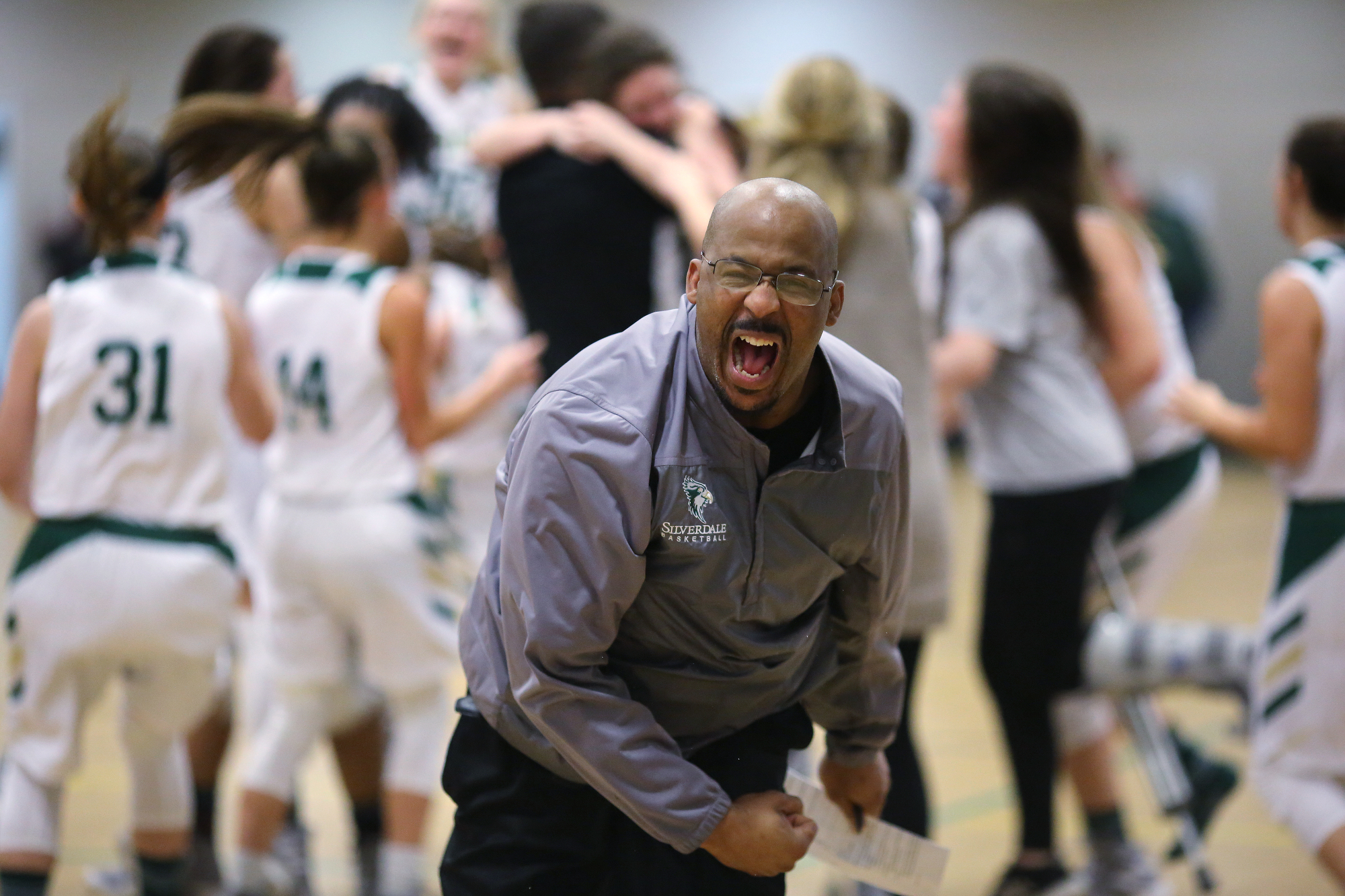 Silverdale girls basketball assistant coach Roger Woods celebrates as Silverdale scores as the time runs out on the clock during the Silverdale vs. Grace Christian Academy region tournament game Tuesday, February 12, 2019 at Silverdale Baptist Academy in Chattanooga, Tennessee.