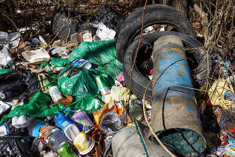 Trash litters the banks of Chattanooga Creek near Burnt Mill Road on Wednesday, Feb. 13, 2019, in Chattanooga, Tenn. Trash continues to be a significant problem in the creek, despite cleanup efforts by volunteers.