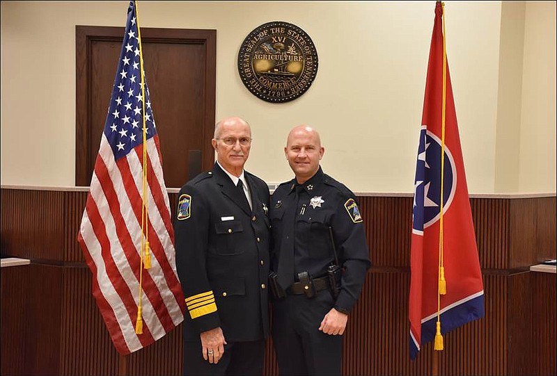 Austin Garrett, right, stands next to Hamilton County Sheriff Jim Hammond at his swearing-in ceremony as new deputy chief of the Hamilton County Sheriff's Office. (Contributed photo/Hamilton County Sheriff's Office)