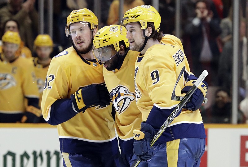 Nashville Predators defenseman P.K. Subban, center, celebrates with teammates Ryan Johansen, left, and Filip Forsberg after Subban scored against the Detroit Red Wings during the second period of Tuesday night's game in Nashville. Detroit won 3-2, handing the Predators their third straight loss.