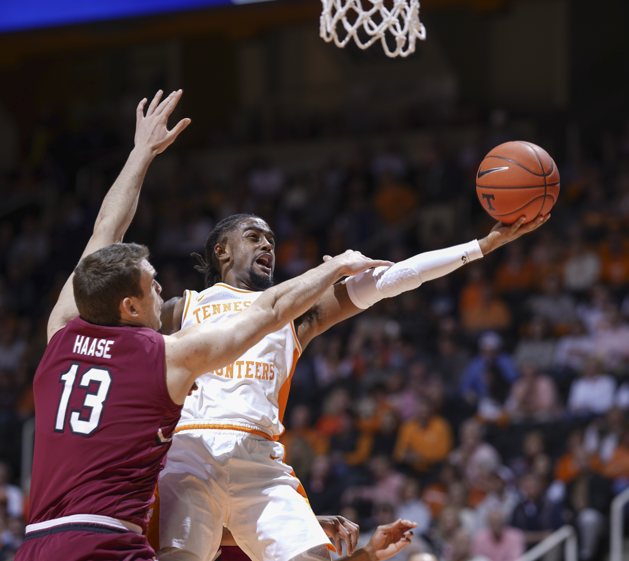 Tennessee's Jordan Bone drives to the basket past South Carolina's Felipe Haase during Wednesday night's SEC matchup at Thompson-Boling Arena in Knoxville.