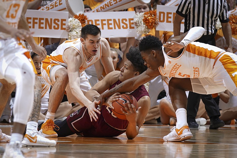 Tennessee's John Fulkerson, left, and Admiral Schofield go after the ball during the Vols' home win against South Carolina on Wednesday night.