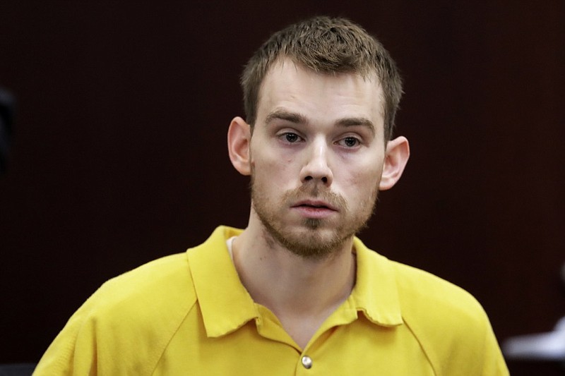 In this Aug. 22, 2018, file photo, Travis Reinking appears at a hearing in Nashville, Tenn. Reinking, accused of killing four people at a Tennessee Waffle House, has finally pleaded not guilty, nearly 10 months after his arrest. He has been held without bond since the attack last April 22. Reinking did not appear at his arraignment in Nashville on Wednesday, Feb. 13, 2019, where his lawyer entered the plea. (AP Photo/Mark Humphrey, File)