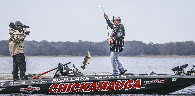 With his boat advertising both his Georgia hometown and the nearby Tennessee lake, Buddy Gross pulls in a bass on Feb. 9, 2019, when he took the lead on the way to victory in the FLW Tour event on Florida's Lake Toho.