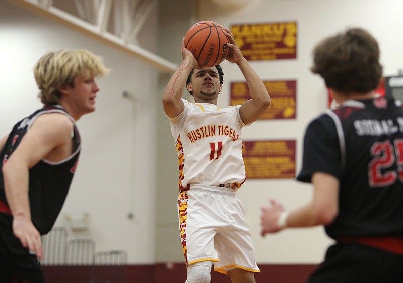 Howard's Dewayne Lawry takes a 3-point shot during a District 6-AA tournament elimination game against visiting Signal Mountain on Thursday night.