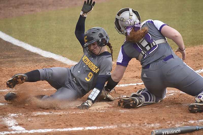 UTC's Emily Coltharp slides past Tennessee Tech catcher Ashley McGowan to score and make it 1-1 in the bottom of the first inning during a Chattanooga Challenge game Friday at Frost Stadium. UTC beat Tennessee Tech 10-2 and topped Indiana State 6-5 later in the day, with both games shortened to five innings — the first by the run rule and the second by rain.