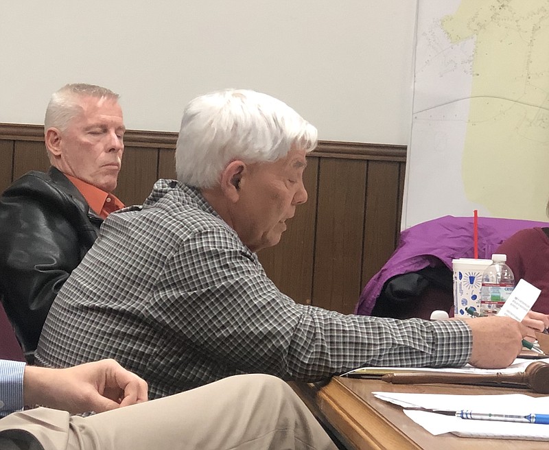 Jasper, Tennessee, Mayor Paul Evans reads from a prepared statement at the board's February meeting.