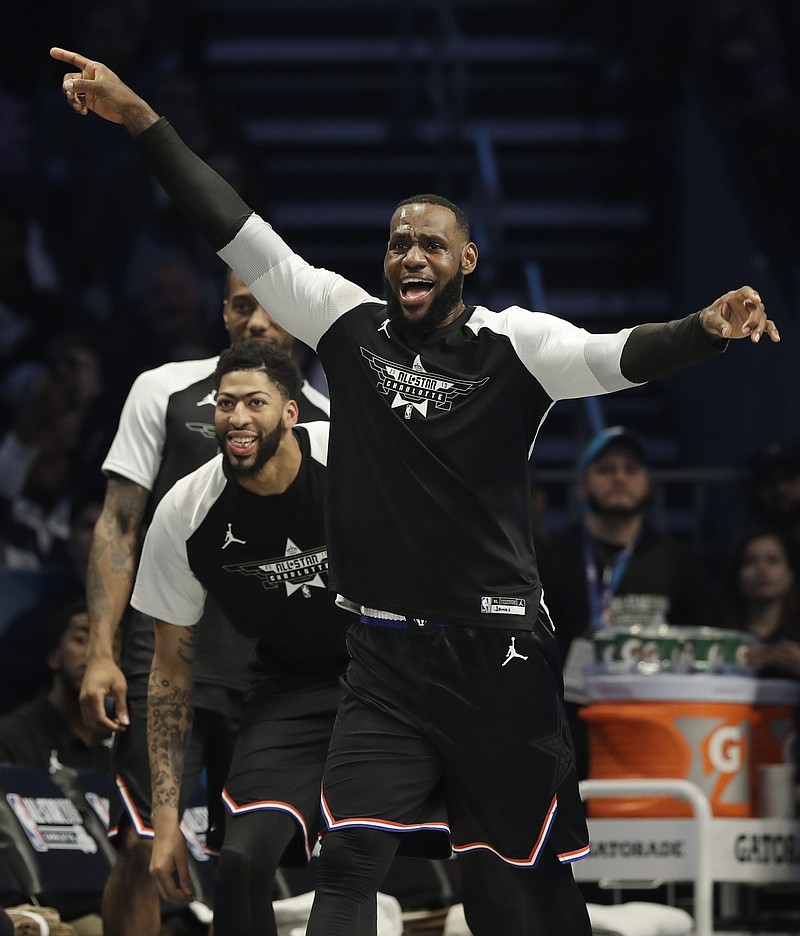 Team LeBron's LeBron James, of the Cleveland Cavaliers celebrates a basket against Team Giannis during the second half of an NBA All-Star basketball game, Sunday, Feb. 17, 2019, in Charlotte, N.C. (AP Photo/Chuck Burton)