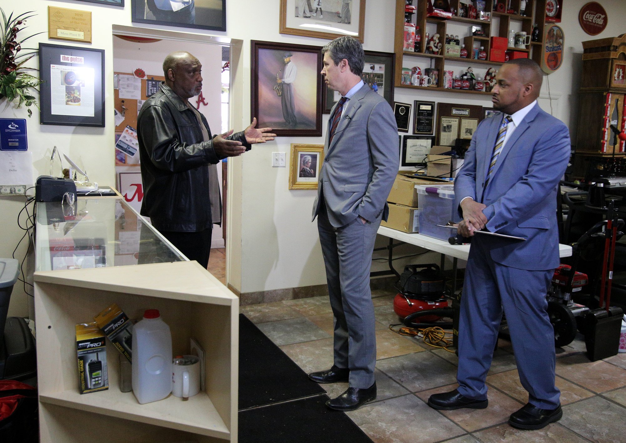 Darnell Moss, the owner of Moss' Place Catering, speaks with Chattanooga Mayor Andy Berke and Jermaine Freeman, the director of economic programs in the Chattanooga Office of Economic and Community Development, at Moss' Place Catering Monday, February 18, 2019 in Chattanooga, Tennessee. Moss is one of several business owners who are expected to benefit from a new loan initiative proposed by Berke that is aimed at bolstering existing small businesses and neighborhoods.