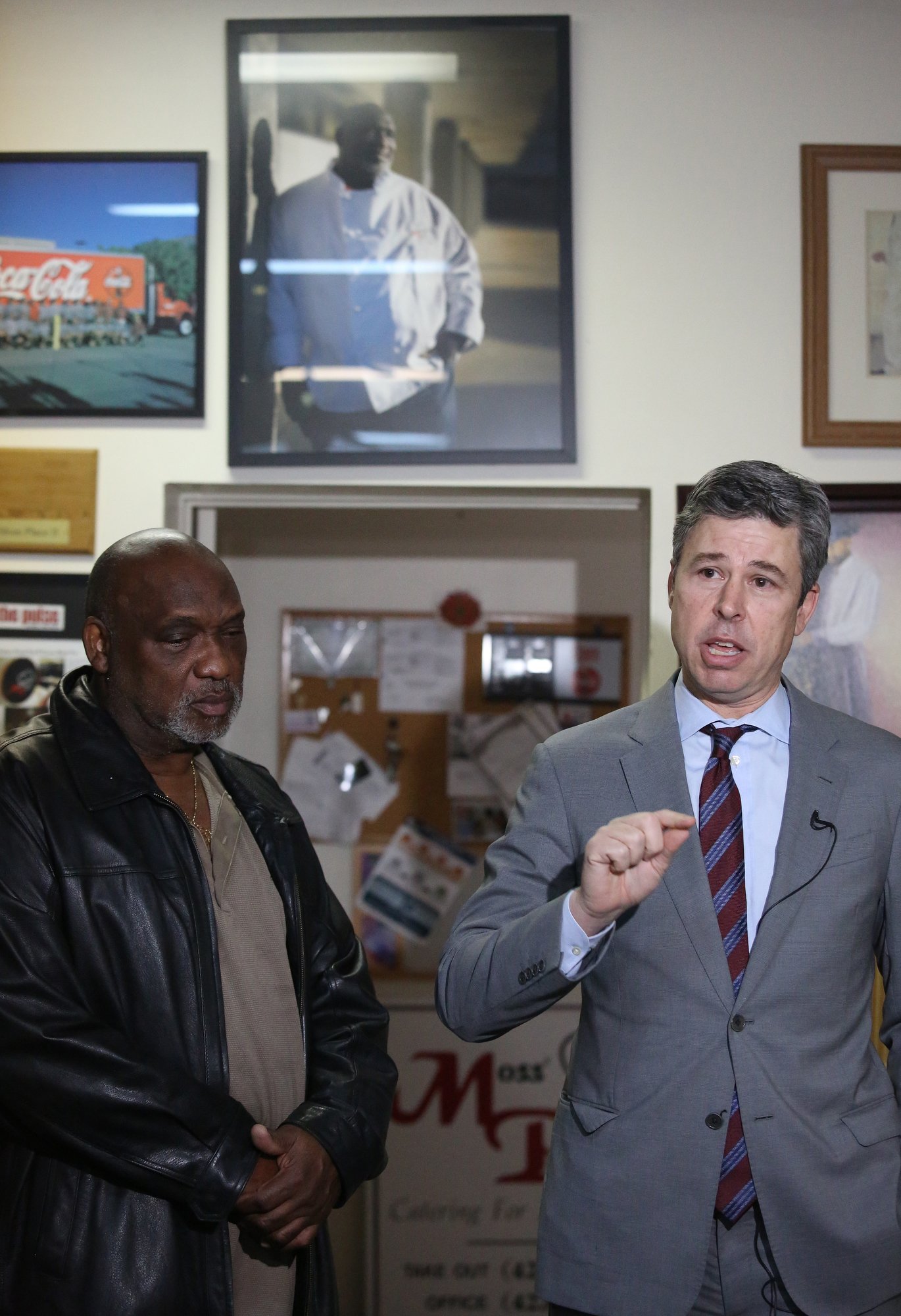 As the owner of Moss' Place stands alongside him, Chattanooga Mayor Andy Berke speaks about a new loan initiative aimed at helping small businesses at Moss' Place Catering Monday, February 18, 2019 in Chattanooga, Tennessee. The Neighborhood Reinvestment Fund is slated to use $500,000 in city money to help small businesses with facility renovations, equipment and inventory acquisition and even marketing.