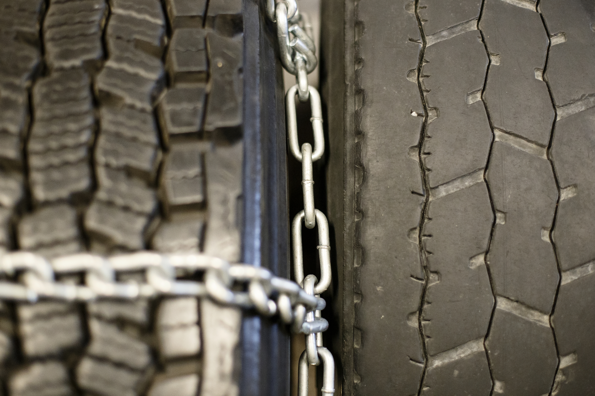 The tire chaining, left, and tire inspection stations are seen in the Commercial Motor Vehicle Lab at the U.S. Xpress Tunnel Hill facility on Tuesday, Feb. 19, 2019 in Tunnel Hill, Ga. The CMV Lab is part of the Professional Driver Development program. The lab has nine stations where potential drivers are able to get hands-on experience checking different parts of their vehicle for defects.