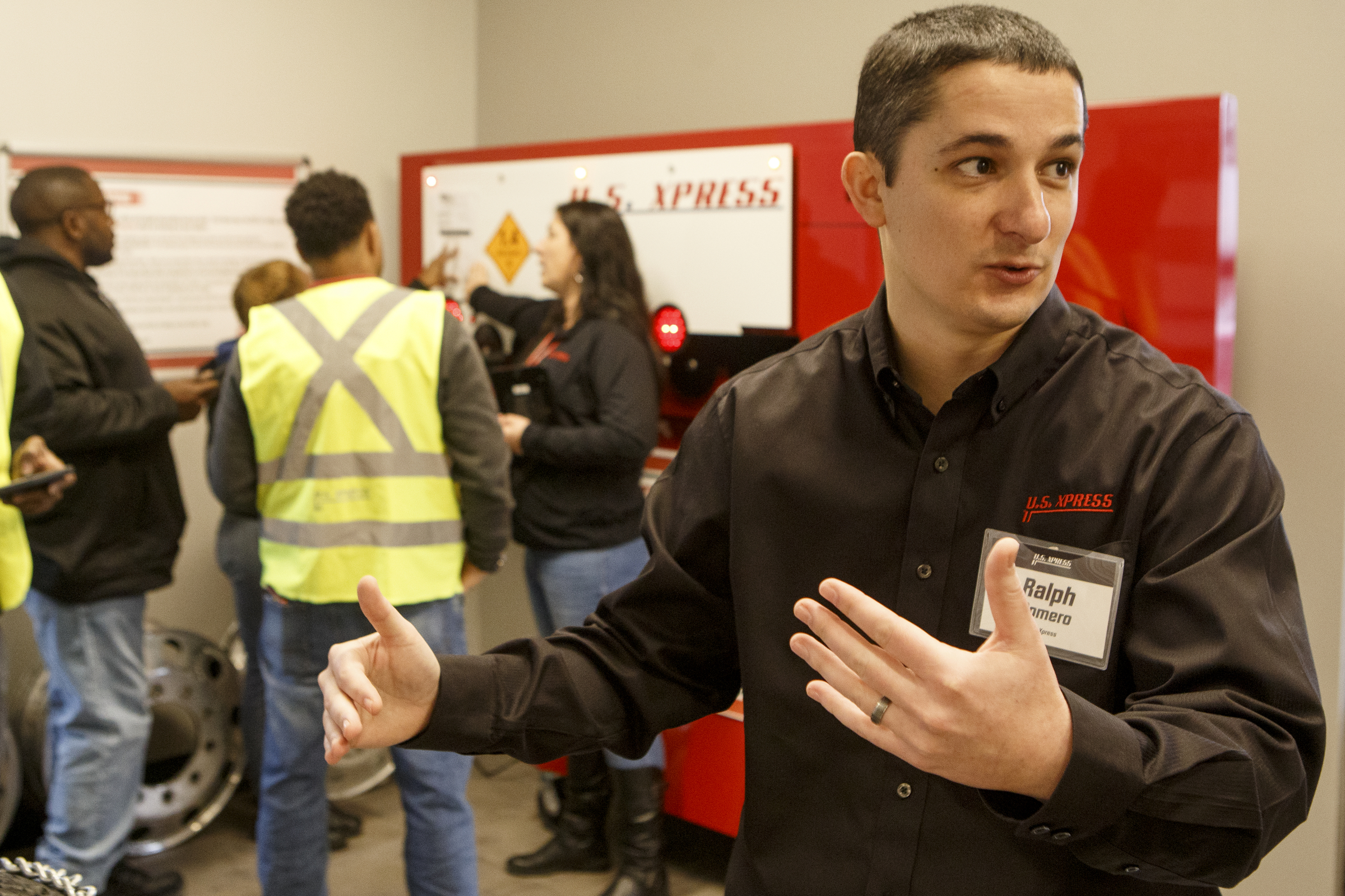 U.S. Xpress Vice President of Organizational Development Ralph Romero speaks while touring the Commercial Motor Vehicle Lab, part of the Professional Driver Development program, at the U.S. Xpress Tunnel Hill facility on Tuesday, Feb. 19, 2019 in Tunnel Hill, Ga.